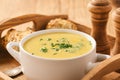 Corn cream soup on wooden background. Royalty Free Stock Photo