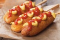 Corn dog with mustard and ketchup Royalty Free Stock Photo