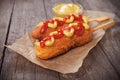 Corn dog with mustard and ketchup Royalty Free Stock Photo