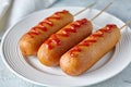 Corn dog traditional American corndog street food deep fried hotdog meat sausage snack with mustard Royalty Free Stock Photo