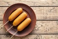 Corn dog traditional American corndog street junk food deep fried hot meat sausage snack Royalty Free Stock Photo