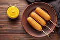 Corn dog traditional American corndog street junk food deep fried hotdog sausage snack with mustard Royalty Free Stock Photo