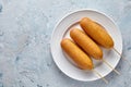 Corn dog traditional street junk food deep fried hotdog meat sausage snack with mustard Royalty Free Stock Photo