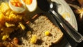 Corn Eggs Bread and Raisins on white plate