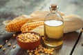 Corn essential oil bottle, seeds in bowl and corncobs Royalty Free Stock Photo