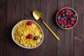 Corn flakes with berries in bowl Royalty Free Stock Photo