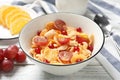 Corn flakes with berries on white wooden table. Healthy breakfast Royalty Free Stock Photo