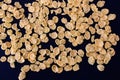 Corn flakes on a black background cornflakes Royalty Free Stock Photo