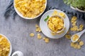 Corn flakes bowl sweets on gray cement background Royalty Free Stock Photo