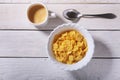 Corn Flakes cereal in a bowl and cap with espresso coffee. Morning breakfast. Royalty Free Stock Photo