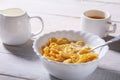 Corn Flakes cereal in a bowl, glass with milk and cap with espresso coffee. Morning breakfast. Royalty Free Stock Photo