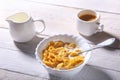 Corn Flakes cereal in a bowl, glass with milk and cap with espresso coffee. Morning breakfast. Royalty Free Stock Photo