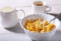 Corn Flakes cereal in a bowl, glass with milk and cap with espresso coffee. Morning breakfast. Royalty Free Stock Photo