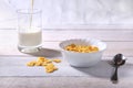 Corn Flakes cereal in a bowl and glass with milk. Morning breakfast. Royalty Free Stock Photo