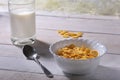 Corn Flakes cereal in a bowl and glass with milk. Morning breakfast. Royalty Free Stock Photo