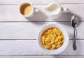 Corn Flakes cereal with milk in a bowl and cap with espresso coffee. Morning breakfast. Royalty Free Stock Photo