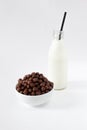 Corn Flakes Chocolate Balls in the Bowl with bottle milk Isolate Royalty Free Stock Photo