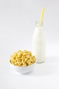 Corn Flakes in the form Stars in the Bowl with bottle milk Isolated Top View on White Background Royalty Free Stock Photo