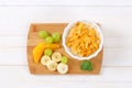 Corn flakes with milk and fresh fruit Royalty Free Stock Photo