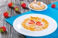 Corn flakes with milk and strawberries, close-up Royalty Free Stock Photo