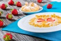 Corn flakes with milk and strawberries, close-up Royalty Free Stock Photo