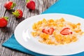 Corn flakes with milk and strawberries, close-up Royalty Free Stock Photo