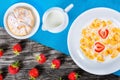 Corn flakes with milk and strawberries, close-up Royalty Free Stock Photo