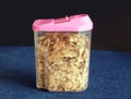 Corn flakes in transparent plastic container closeup Royalty Free Stock Photo