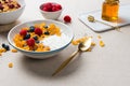 Corn flakes with yogurt, almonds, blueberries, raspberries and c