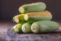 Corn. Fresh corn on old rustic oak table