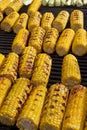 Corn. Fresh organic corn cobs grilling on a barbeque. Grilled corns. Yellow baked corn cobs. Grilled corn background texture. Roas Royalty Free Stock Photo