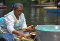 Woman preparing grilled corn