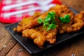 Corn Fritters With chili sauce placed on a wooden table