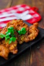 Corn Fritters With chili sauce placed on a wooden table