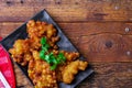 Corn Fritters With chili sauce placed on a wooden table