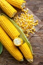 Corn grains on paper with delicious, ripe ears of corn, isolated Royalty Free Stock Photo