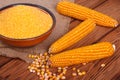 Corn groats in a bowl, whole grain and cob Royalty Free Stock Photo