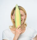 Corn harvest. Girl hold ripe corn. Food vegetarian and healthy natural organic products. Vegetarian menu. Eat corn