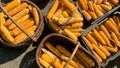 Corn is harvested and dried in sun in baskets and crates on backyard or agricultural farm. Soft focus. Top view. Close-up