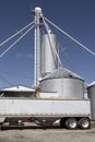 Corn loading onto a truck. After harvest, corn from grain bins loads onto a truck and is sent for food or ethanol processing Royalty Free Stock Photo
