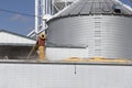 Corn loading onto a truck. After harvest, corn from grain bins loads onto a truck and is sent for food or ethanol processing Royalty Free Stock Photo