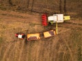 Corn maize harvest, aerial view of tractor and combine harvester Royalty Free Stock Photo