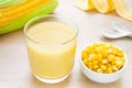 Corn milk in glass, kernel corn in bowl and fresh corn Royalty Free Stock Photo