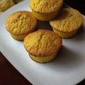 Corn muffins on a white square plate by Generative AI Royalty Free Stock Photo