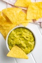 Corn nacho chips and avocado dip. Yellow tortilla chips and guacamole Royalty Free Stock Photo