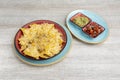 Corn nachos au gratin with grated cheese and beans and two separate bowls of guacamole and pico de gallo Royalty Free Stock Photo