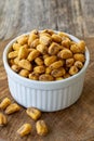 Corn nuts with sauce on wood background. Royalty Free Stock Photo
