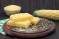 Corn polenta slices on wooden board