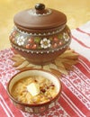 Corn porridge (banish) with a cranberry