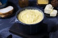 Corn porridge with milk in a black saucepan Royalty Free Stock Photo